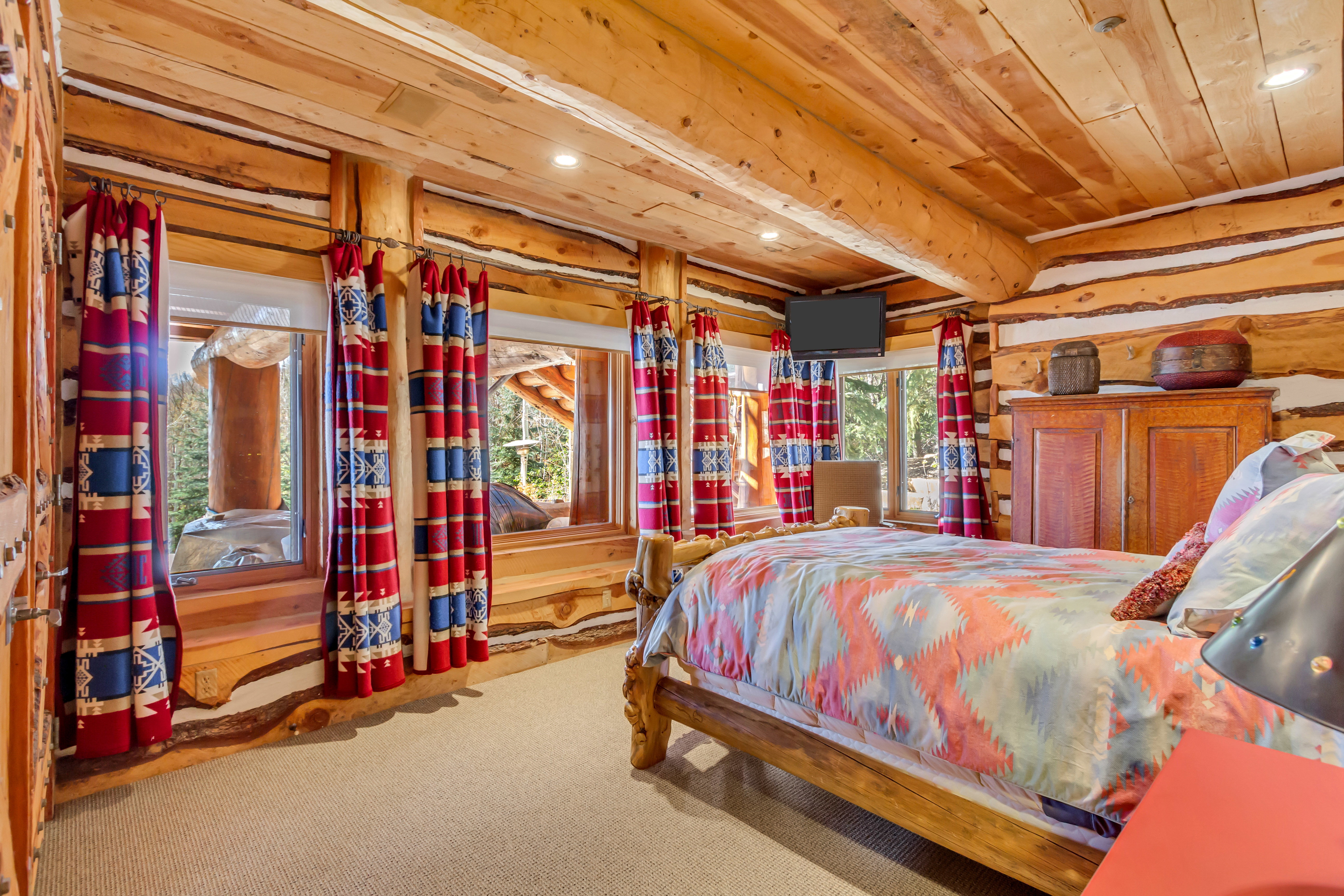 Bedroom with recessed lighting, light colored carpet, and a wood ceiling with exposed beams