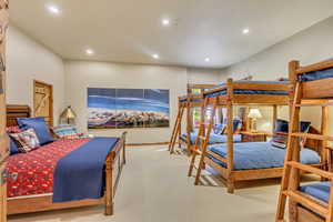 Bedroom featuring light carpet and recessed lighting