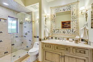 Bathroom with vanity and a shower stall