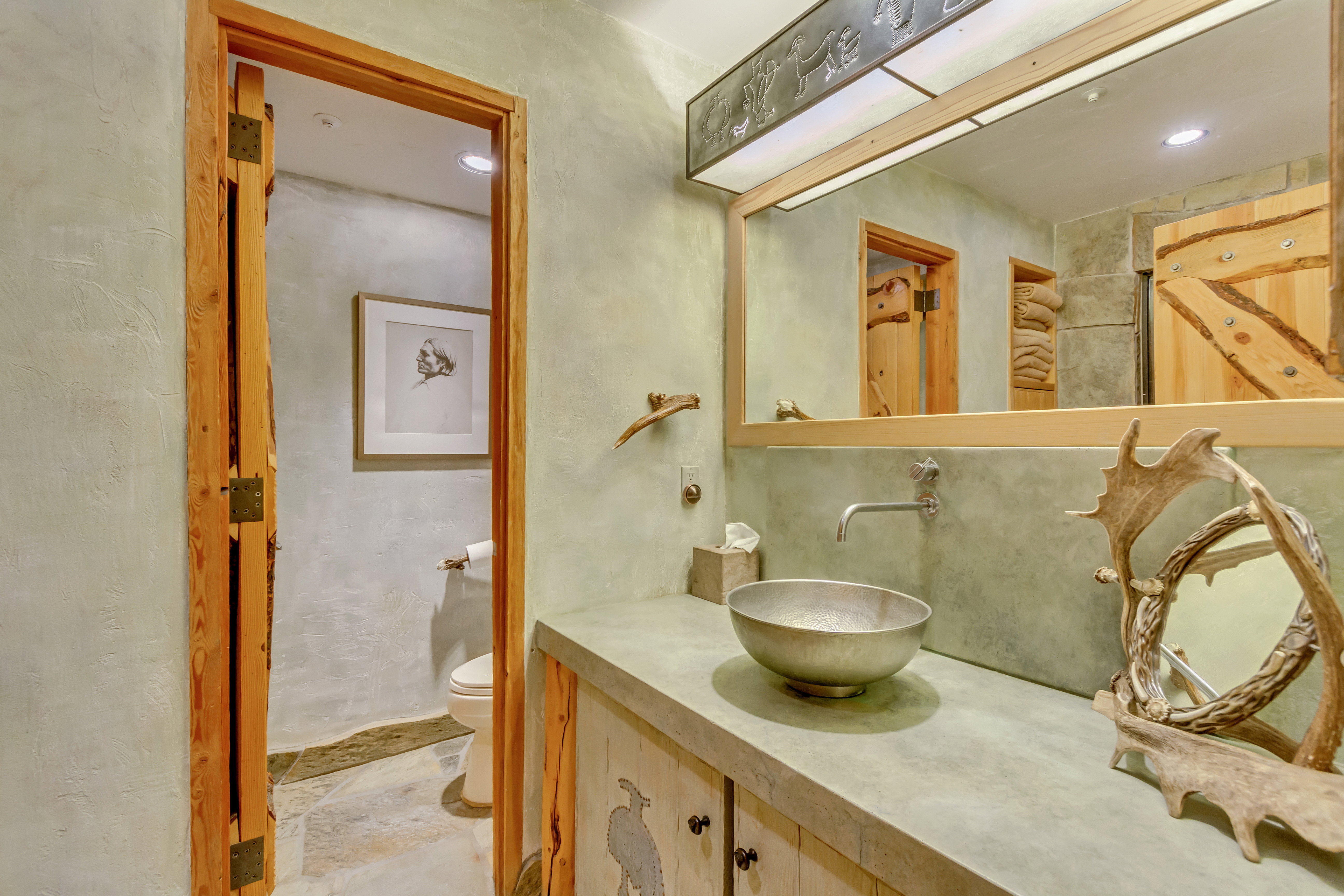 Bathroom with vanity and recessed lighting