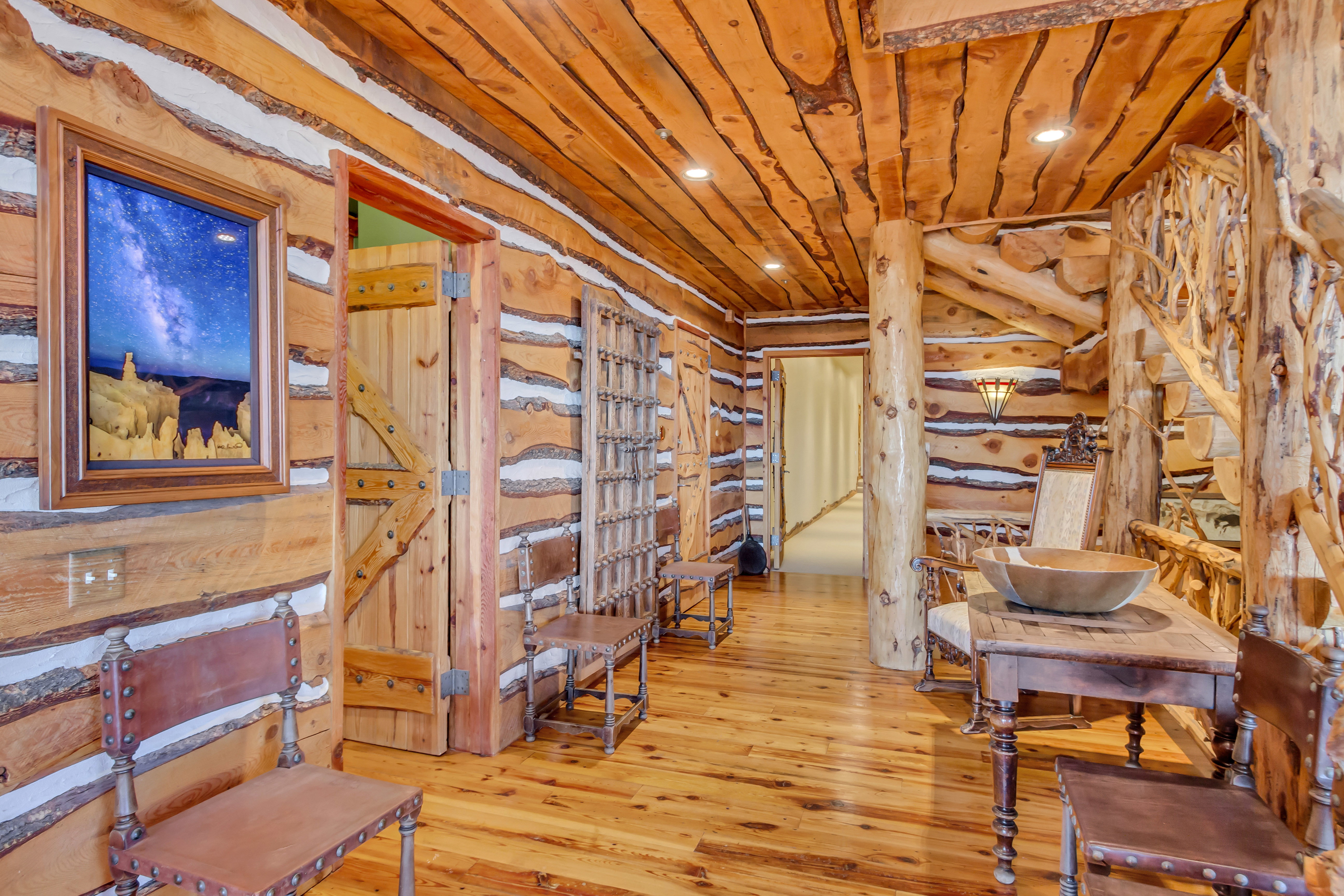 Sitting room with hardwood / wood-style floors, recessed lighting, log walls, and wooden ceiling