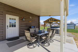 View of patio featuring outdoor dining area