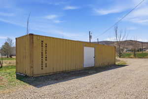 View of outbuilding featuring a mountain view