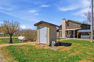 View of shed featuring a hot tub