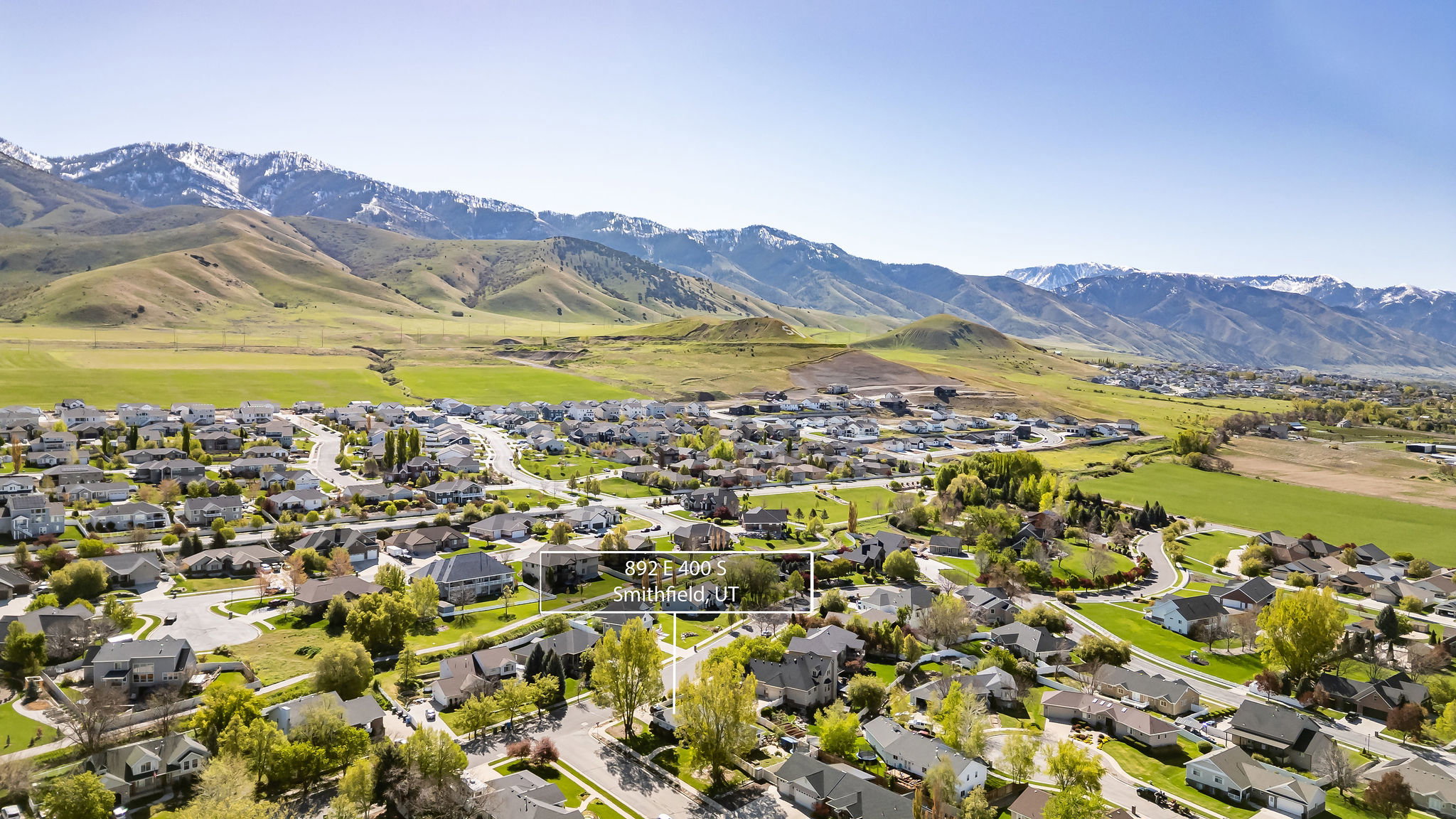 Aerial view of residential area featuring a mountainous background