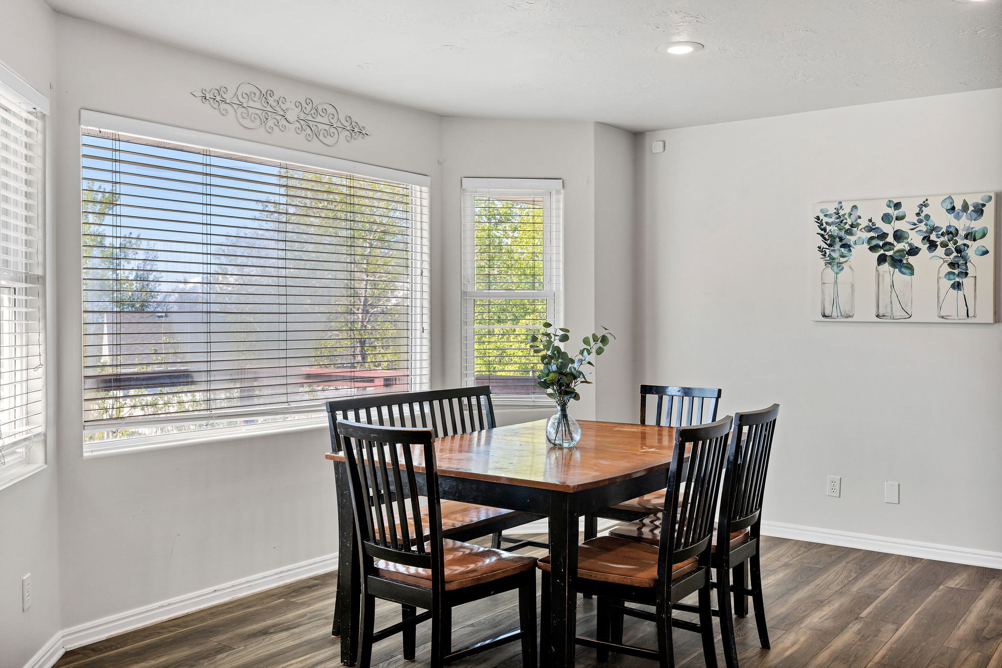 Dining space with dark wood-style floors