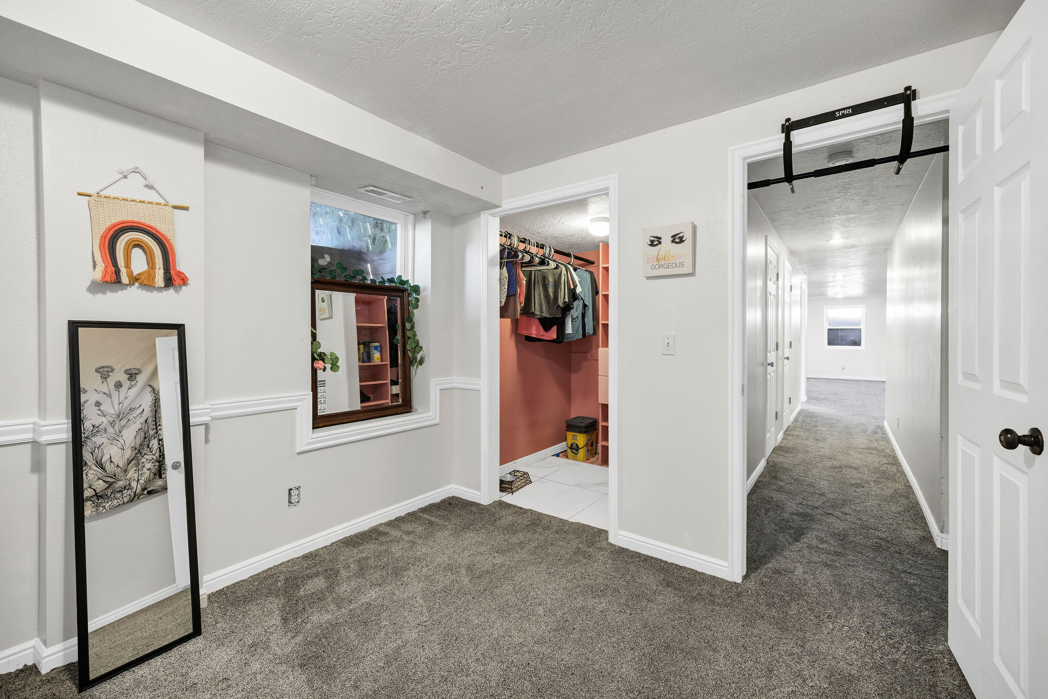 Bedroom featuring a textured ceiling and dark carpet
