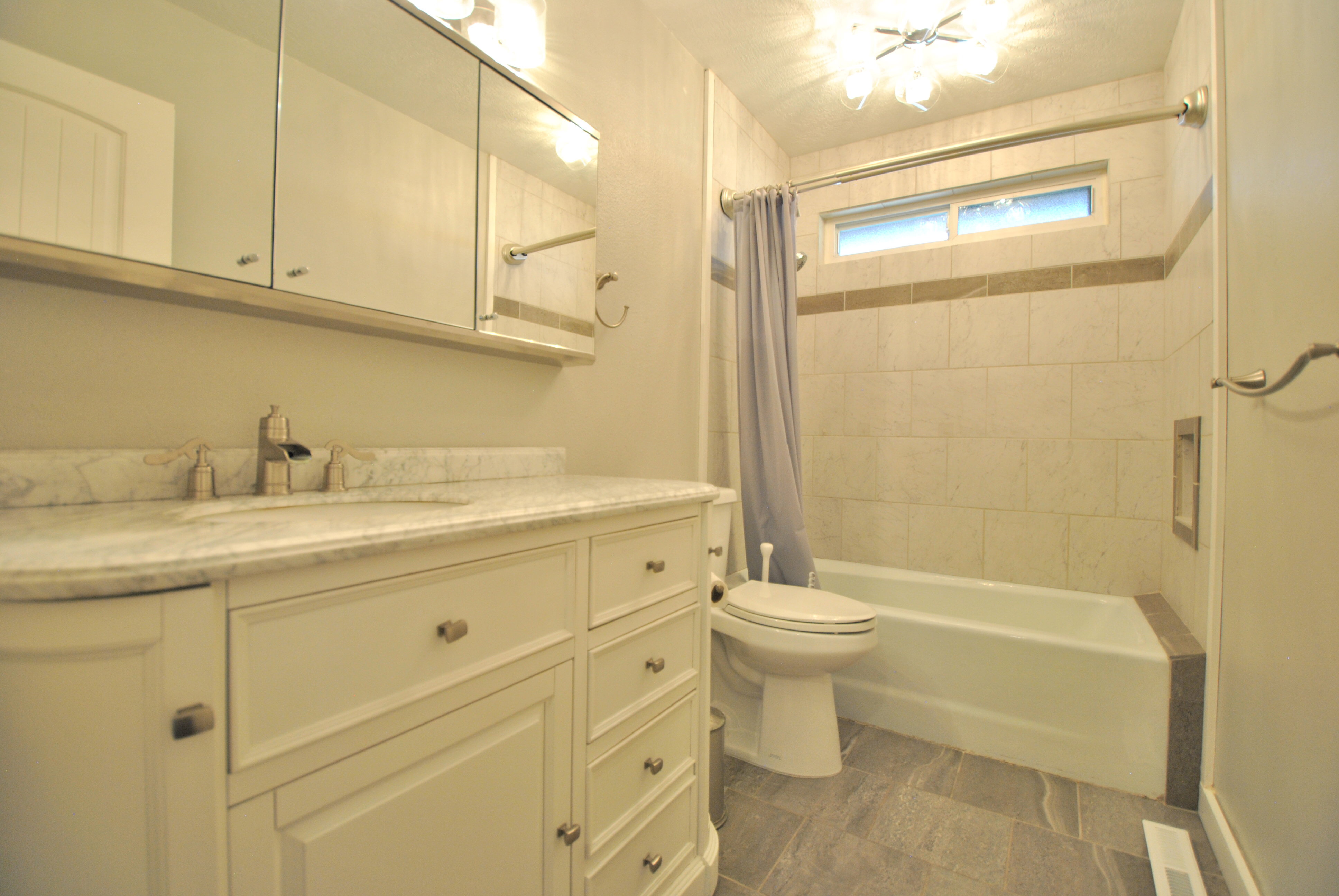 Full bathroom featuring vanity and shower / tub combo