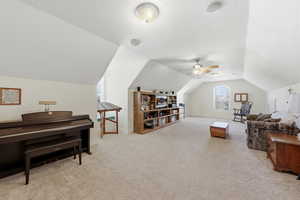 Sitting room with light colored carpet and baseboards
