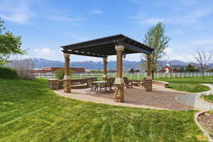 View of home's community with a patio area, a pergola, and a mountain view