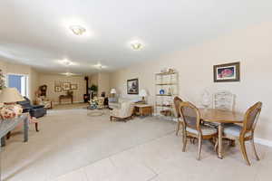 Dining area with light carpet