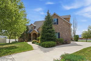 View of front of home with stone siding and stucco siding