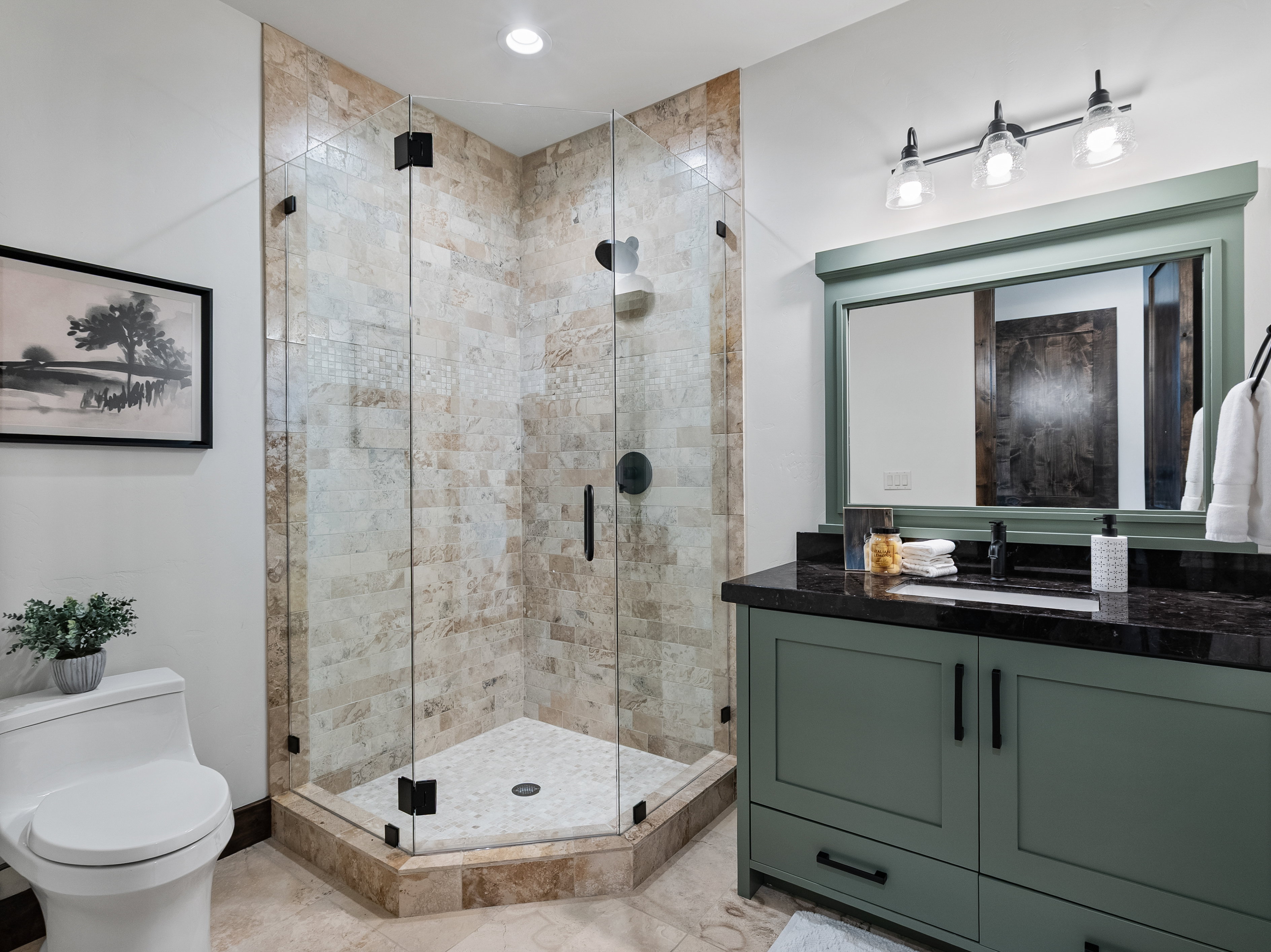Full bathroom with vanity, a shower stall, and recessed lighting