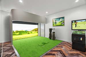 Recreation room featuring golf simulator, parquet floors, recessed lighting, and a mountain view