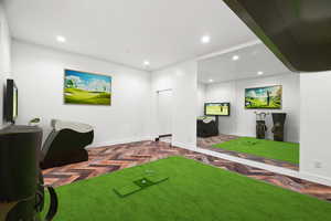 Playroom featuring recessed lighting and parquet flooring
