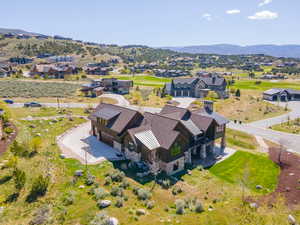 Aerial perspective of suburban area featuring a mountain backdrop