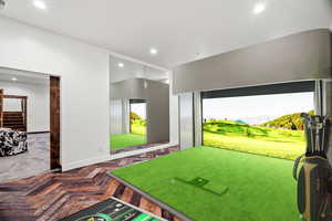 Rec room featuring a mountain view, golf simulator, recessed lighting, and parquet flooring