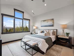 Bedroom featuring light colored carpet, vaulted ceiling, recessed lighting, and a ceiling fan