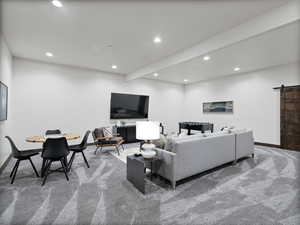 Living room featuring a barn door, light colored carpet, beam ceiling, and recessed lighting