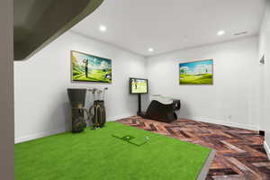 Playroom featuring recessed lighting and parquet flooring