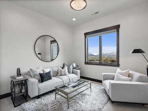 Living room with a mountain view and recessed lighting