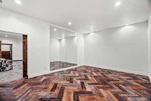Unfurnished room featuring recessed lighting and parquet floors