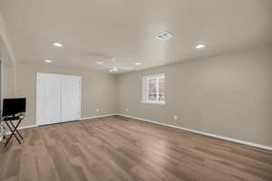 Unfurnished bedroom featuring a ceiling fan, light wood finished floors, a closet, and recessed lighting