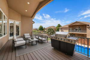 Deck featuring a grill, a residential view, and an outdoor hangout area