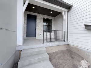 Property entrance with covered porch