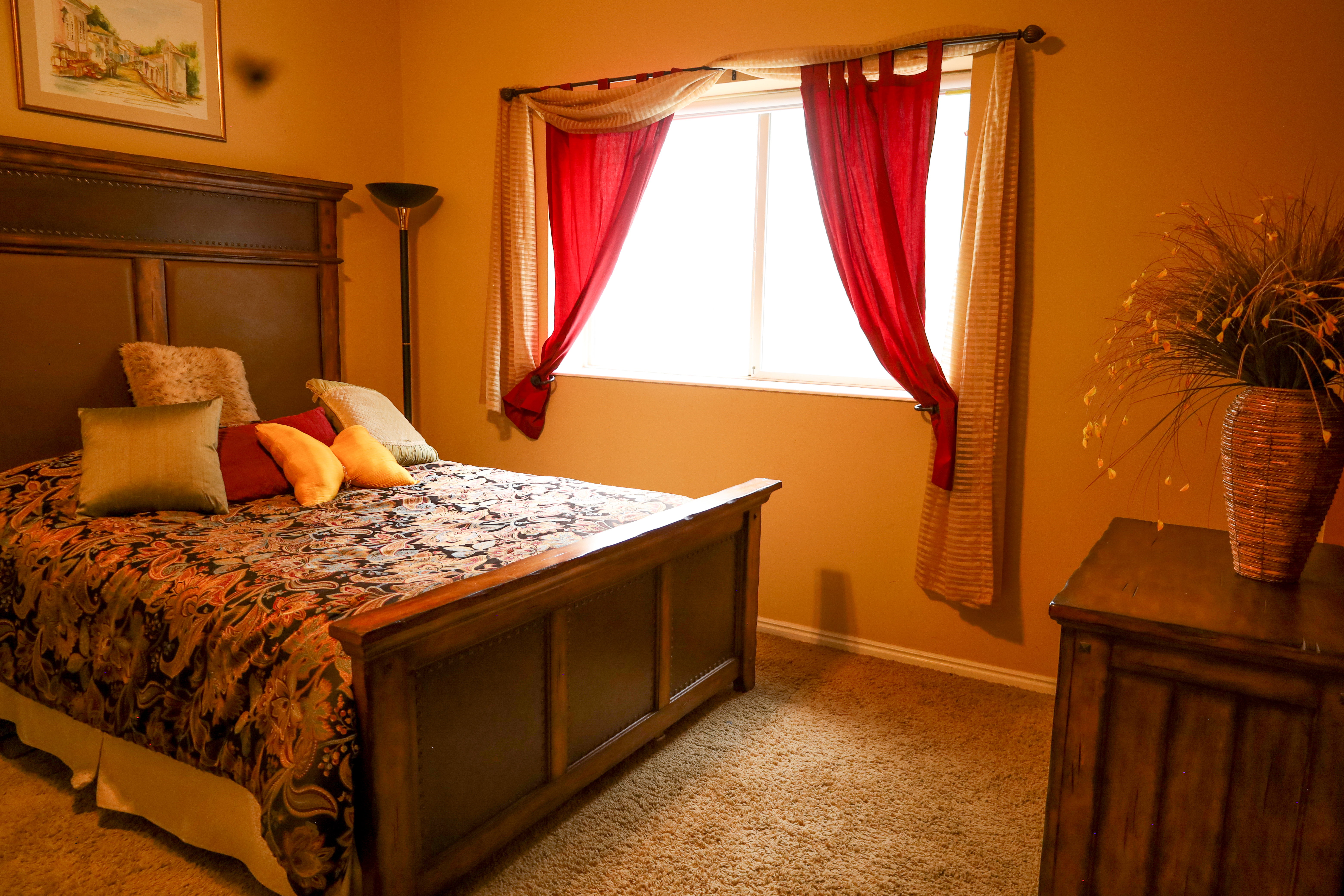 Bedroom with baseboards and carpet floors