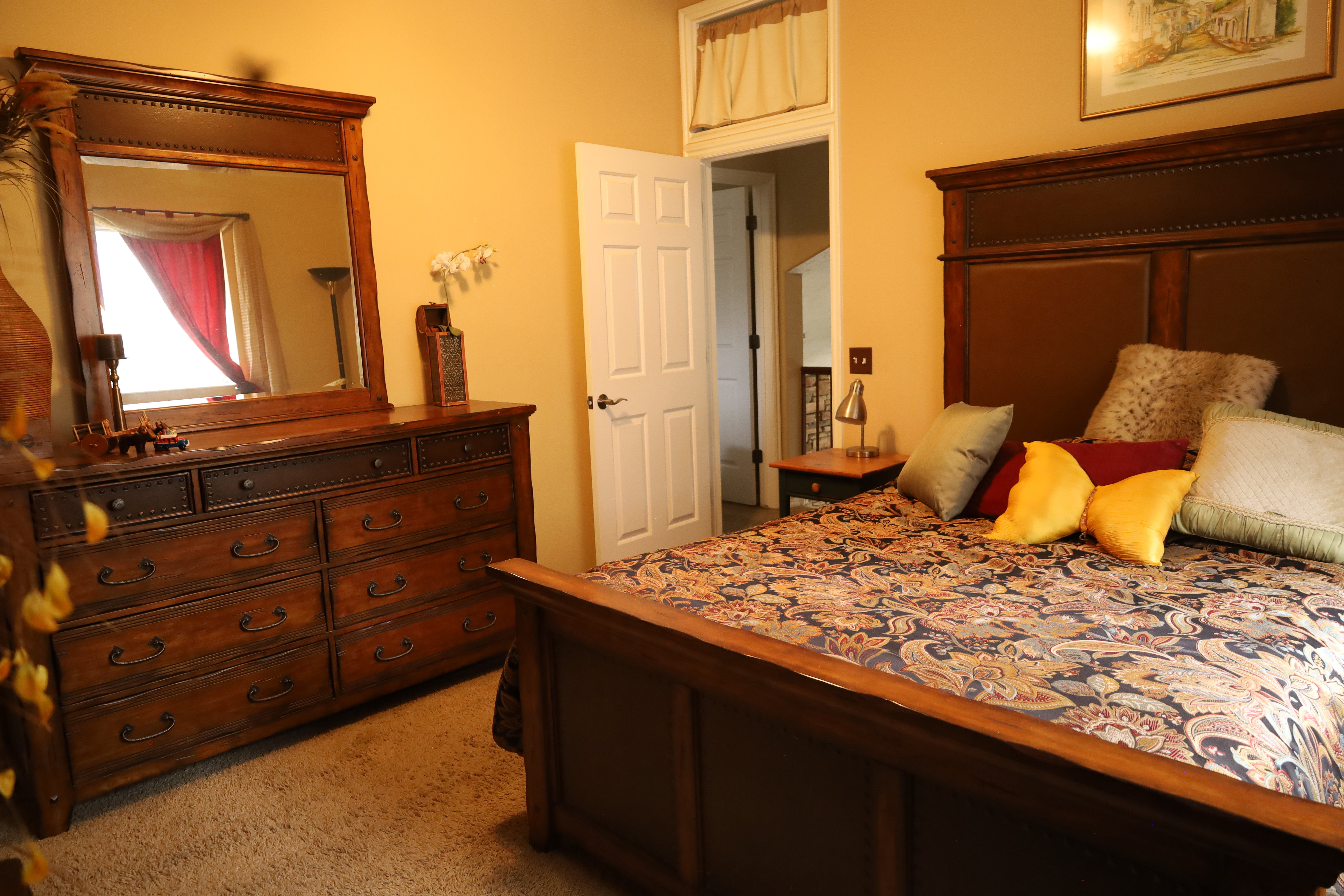 Bedroom with light colored carpet