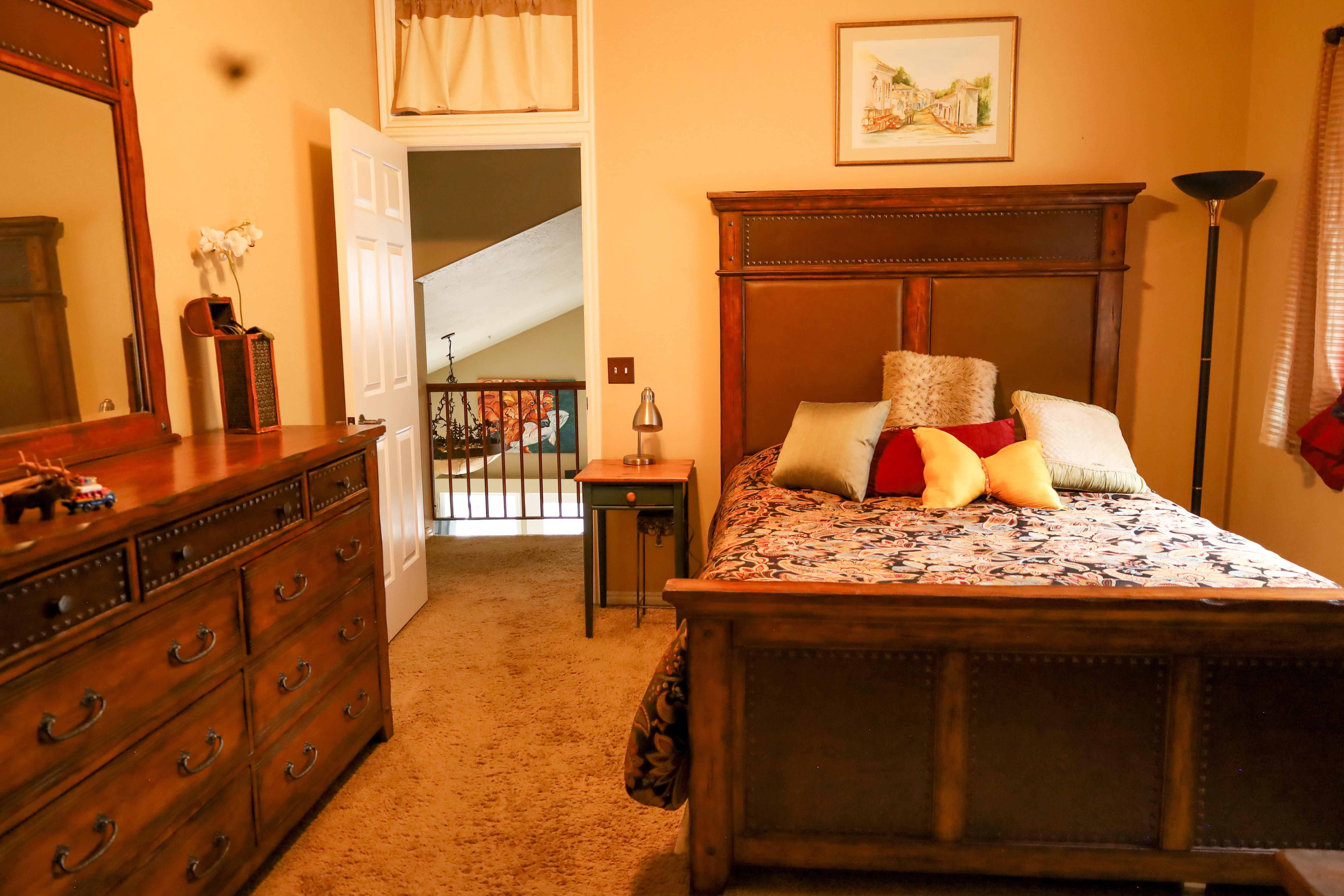 Bedroom with light colored carpet