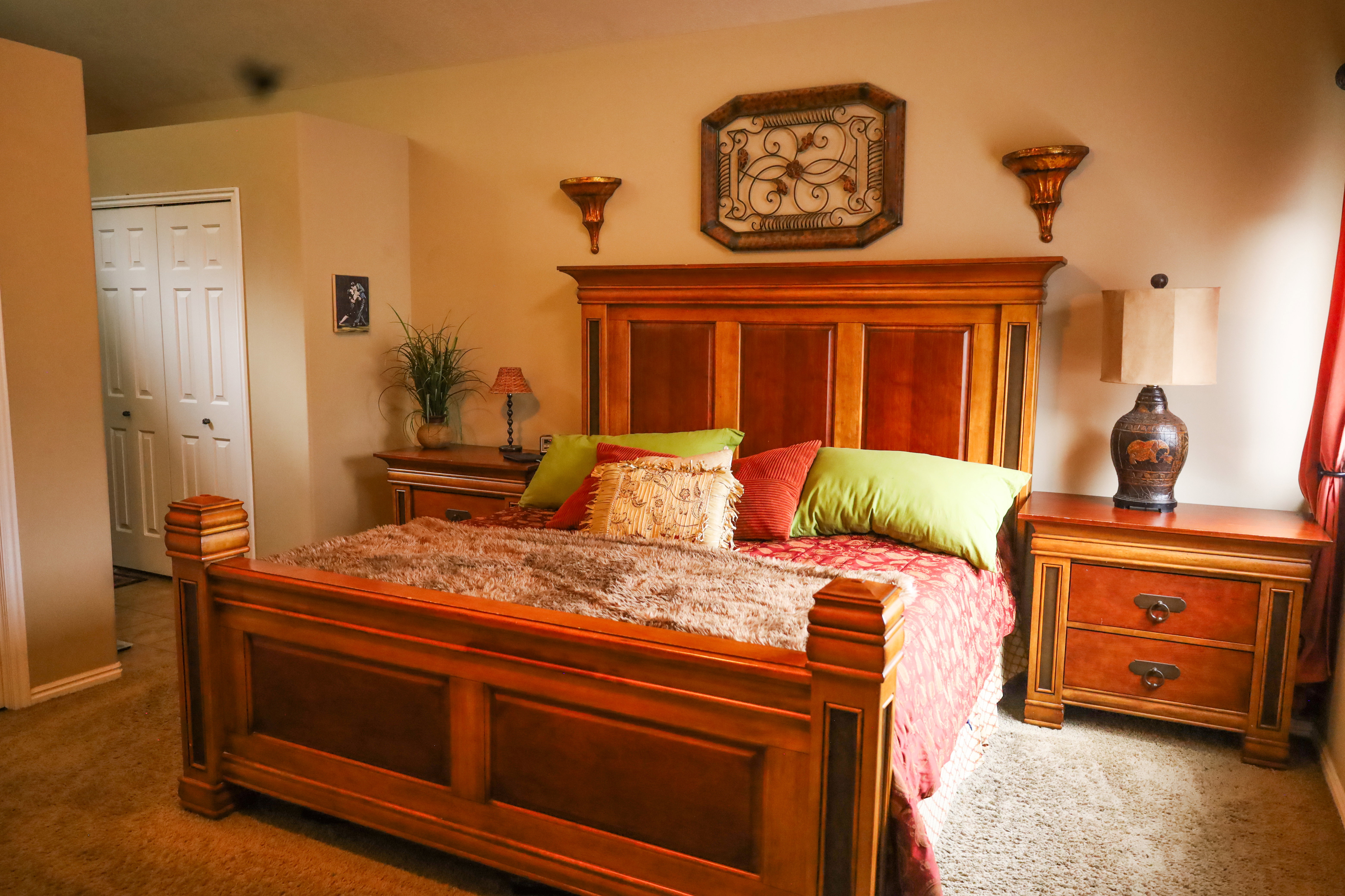 Carpeted bedroom featuring a closet