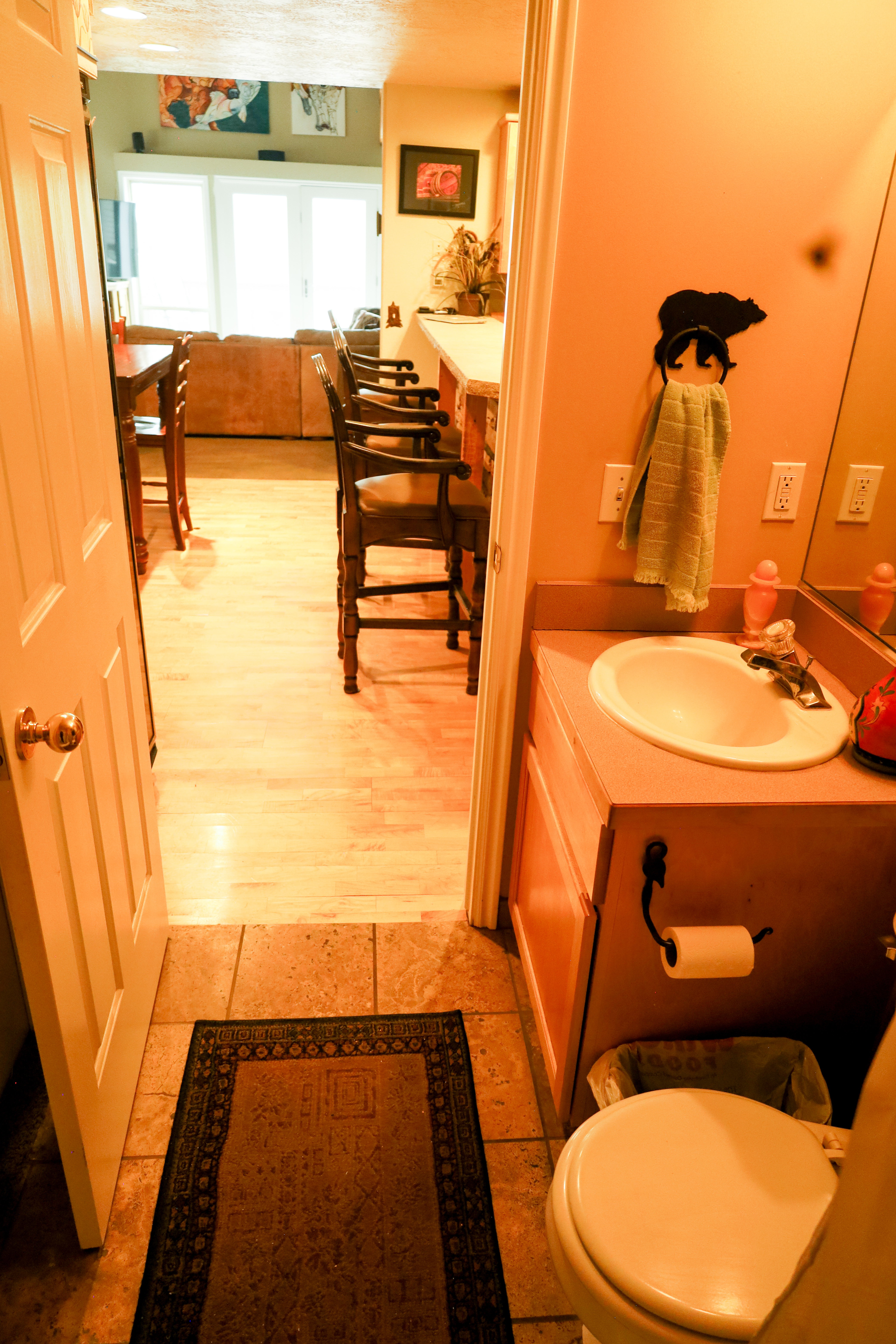 Half bathroom featuring vanity and toilet