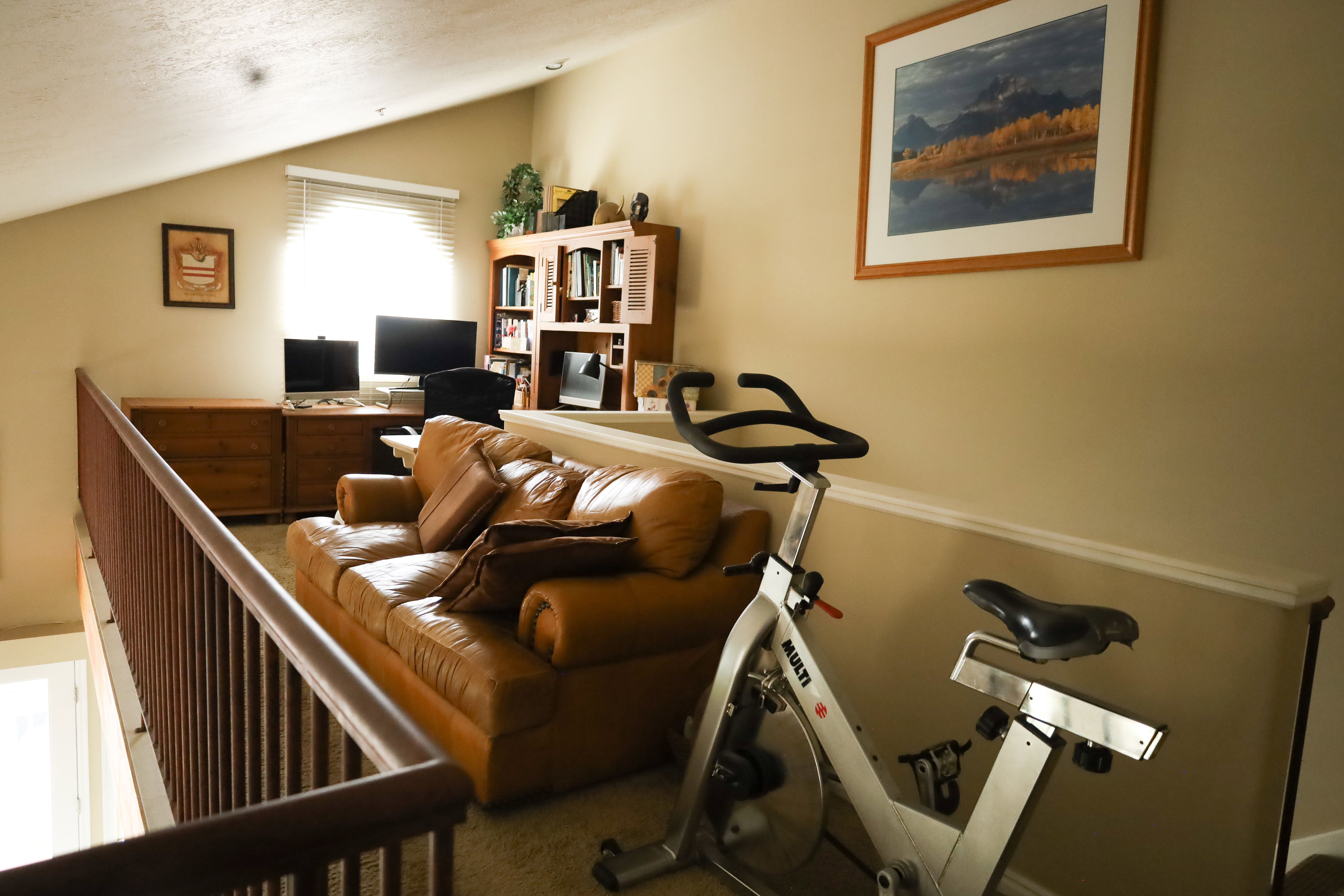 Workout area with lofted ceiling