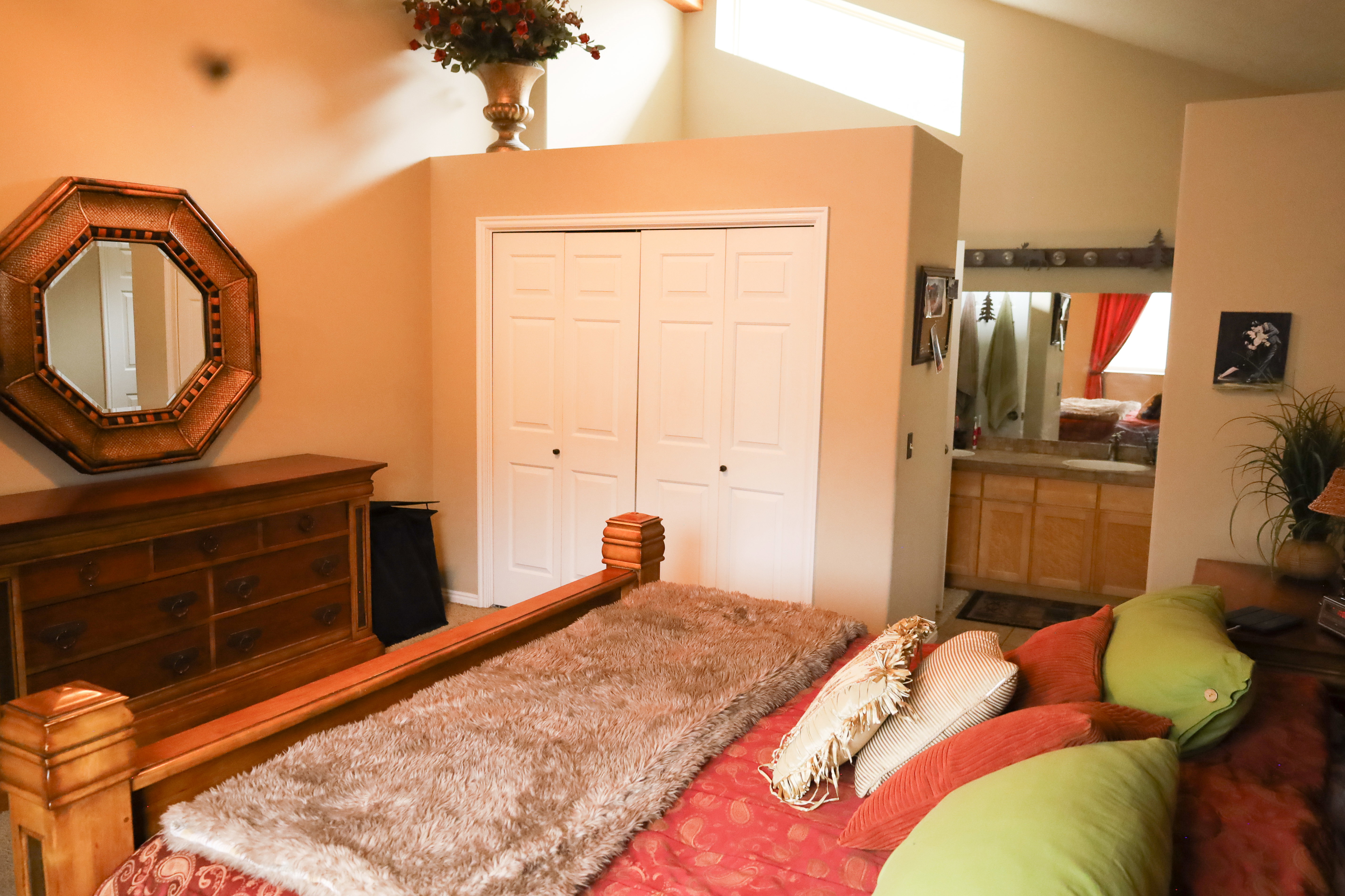 Bedroom featuring a sink and a closet