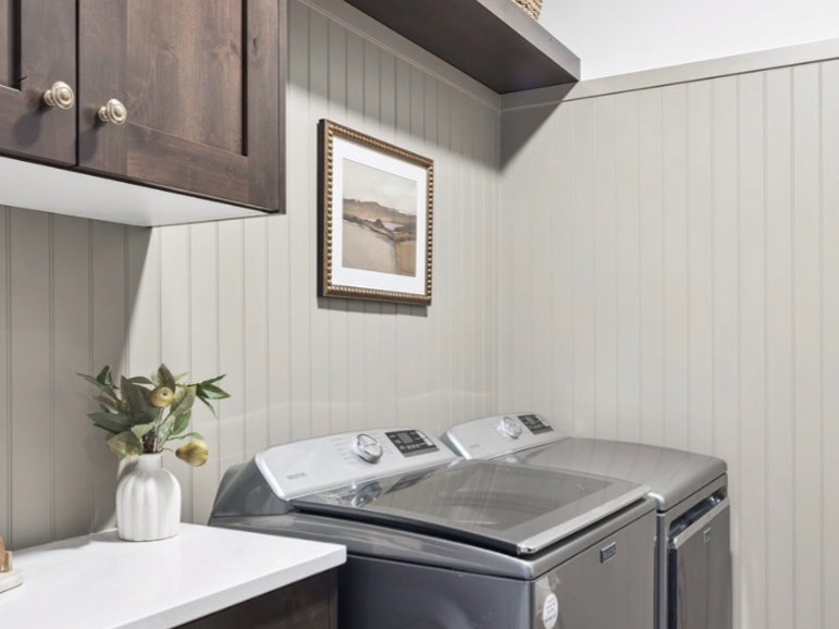 Laundry room featuring cabinet space and independent washer and dryer