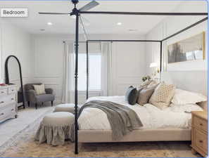 Carpeted bedroom featuring a decorative wall, ceiling fan, and recessed lighting