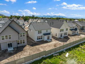 Aerial view of residential area featuring a mountain backdrop