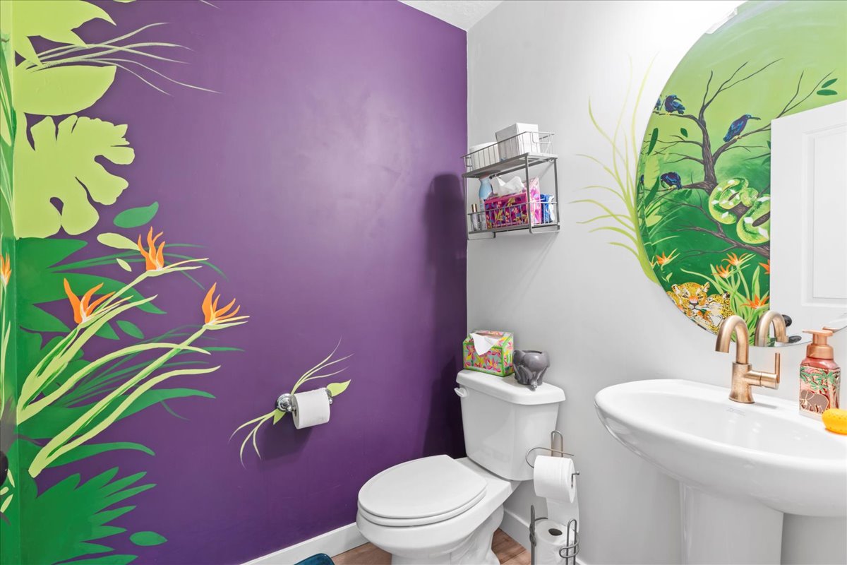 Bathroom with toilet and baseboards
