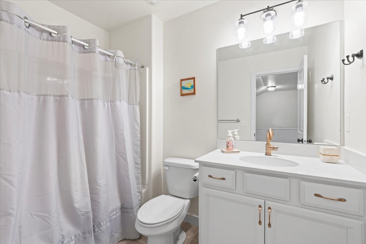 Bathroom featuring vanity and a shower with curtain