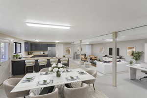 Dining room with a textured ceiling and light carpet