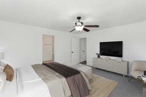 Bedroom featuring carpet and ceiling fan