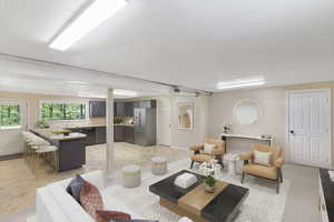 Living area featuring a textured ceiling and baseboards