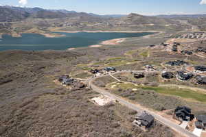 Aerial view of property's location featuring a water and mountain view
