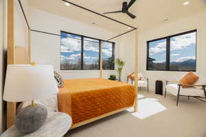 Bedroom with recessed lighting, light colored carpet, ceiling fan, and a mountain view