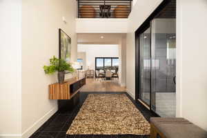 Corridor with a high ceiling and recessed lighting