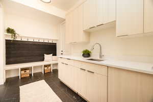 Mudroom featuring a sink