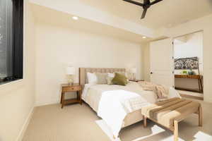 Bedroom with light carpet, recessed lighting, and ceiling fan