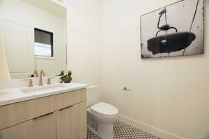 Bathroom featuring toilet and vanity